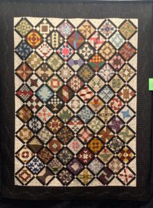 brown sampler quilt in reproduction fabrics