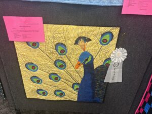 challenge quilt yellow background with Peacock